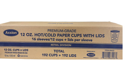 A corrugated cardboard shipping box for Axxion 12-ounce premium disposable paper cups with lids. The printed blue text indicates the retail division box contains 16 sleeves of 12 cups and lids, totaling 192 cups and 192 lids per case.