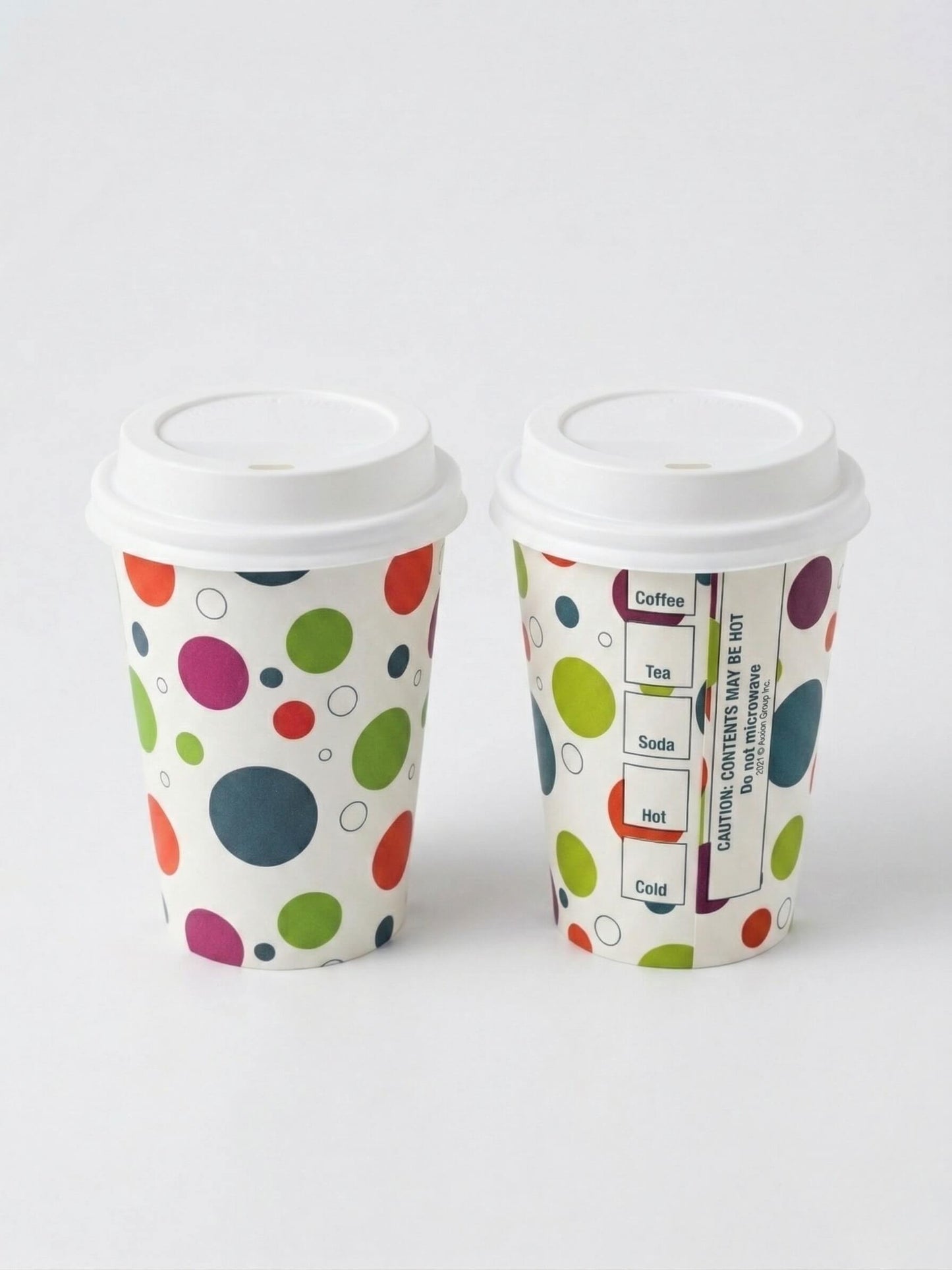 Two Axxion 12-ounce disposable paper cups featuring a polka dot pattern, displayed against a light grey background. One cup has a white travel lid securely attached, while the other is open with its lid leaning against the base. These sets are packaged in 6-count packs and distributed as 288 per case.